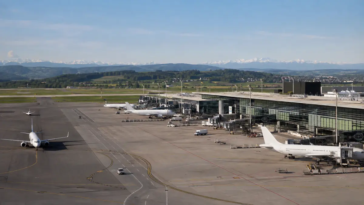 Representative view of Zurich Airport apron, terminal and aircraft.